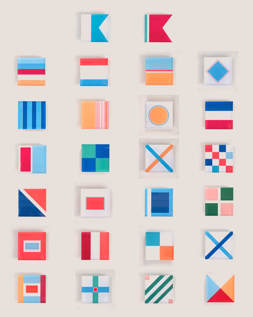 26 small modern minimalist artworks based on nautical flags each one representing a letter of the alphabet